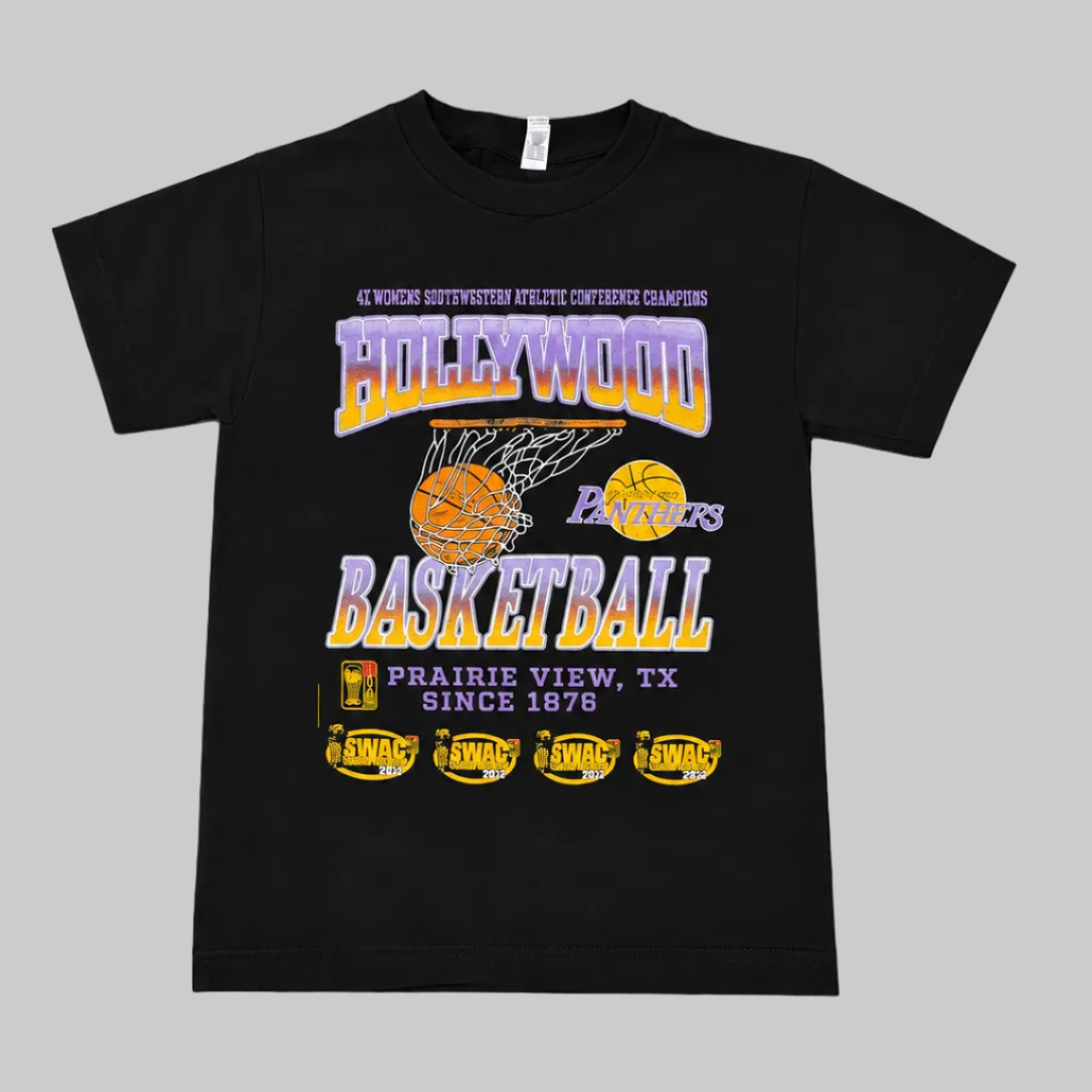 A black short-sleeve graphic T-shirt laid flat on a light gray surface. The front features a large basketball-themed print with yellow championship trophy silhouettes, a basketball, and purple and yellow text reading Hollywood panthers (Prairie View A&M University) 