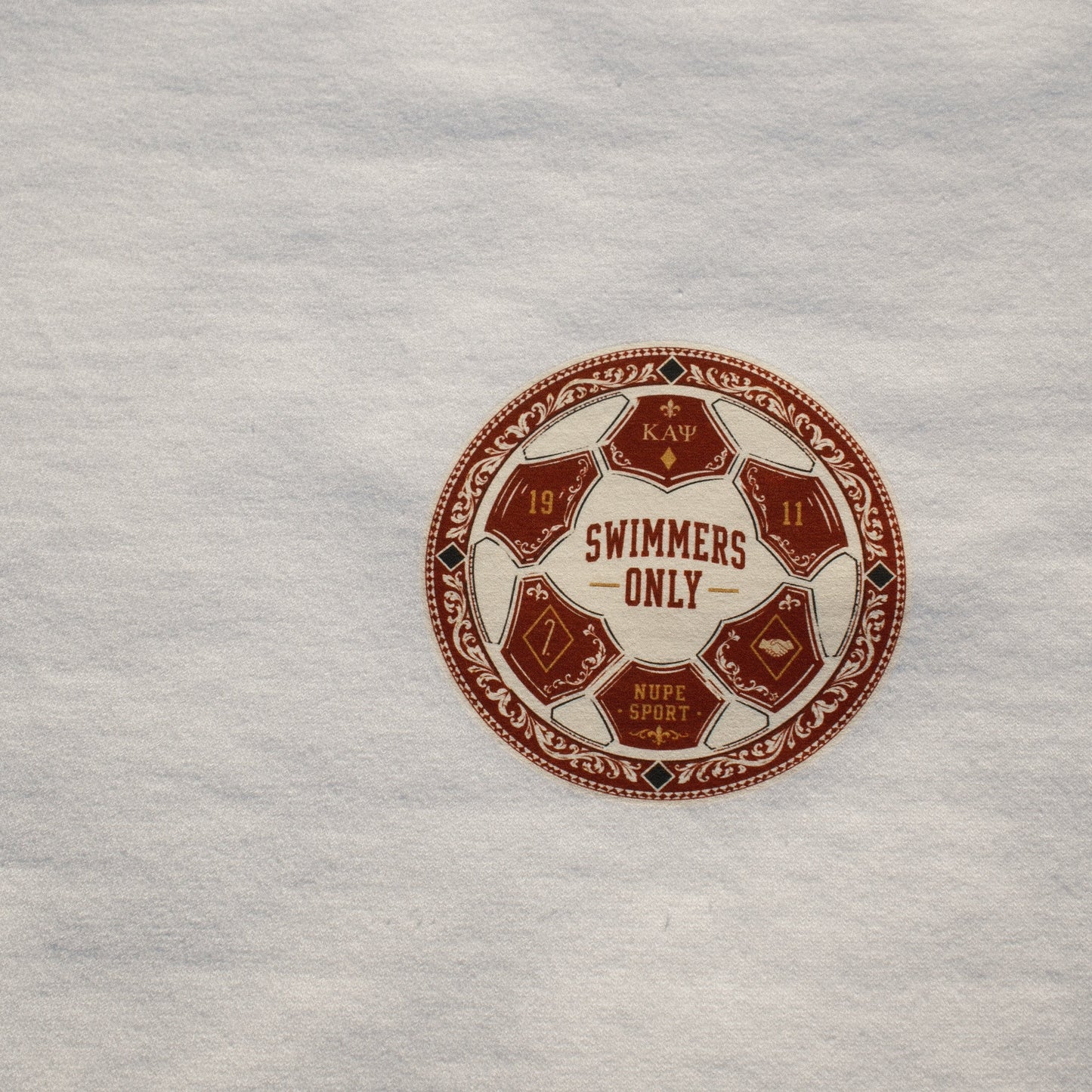 Close-up of a 'Swimmers Only' logo on a textured surface
